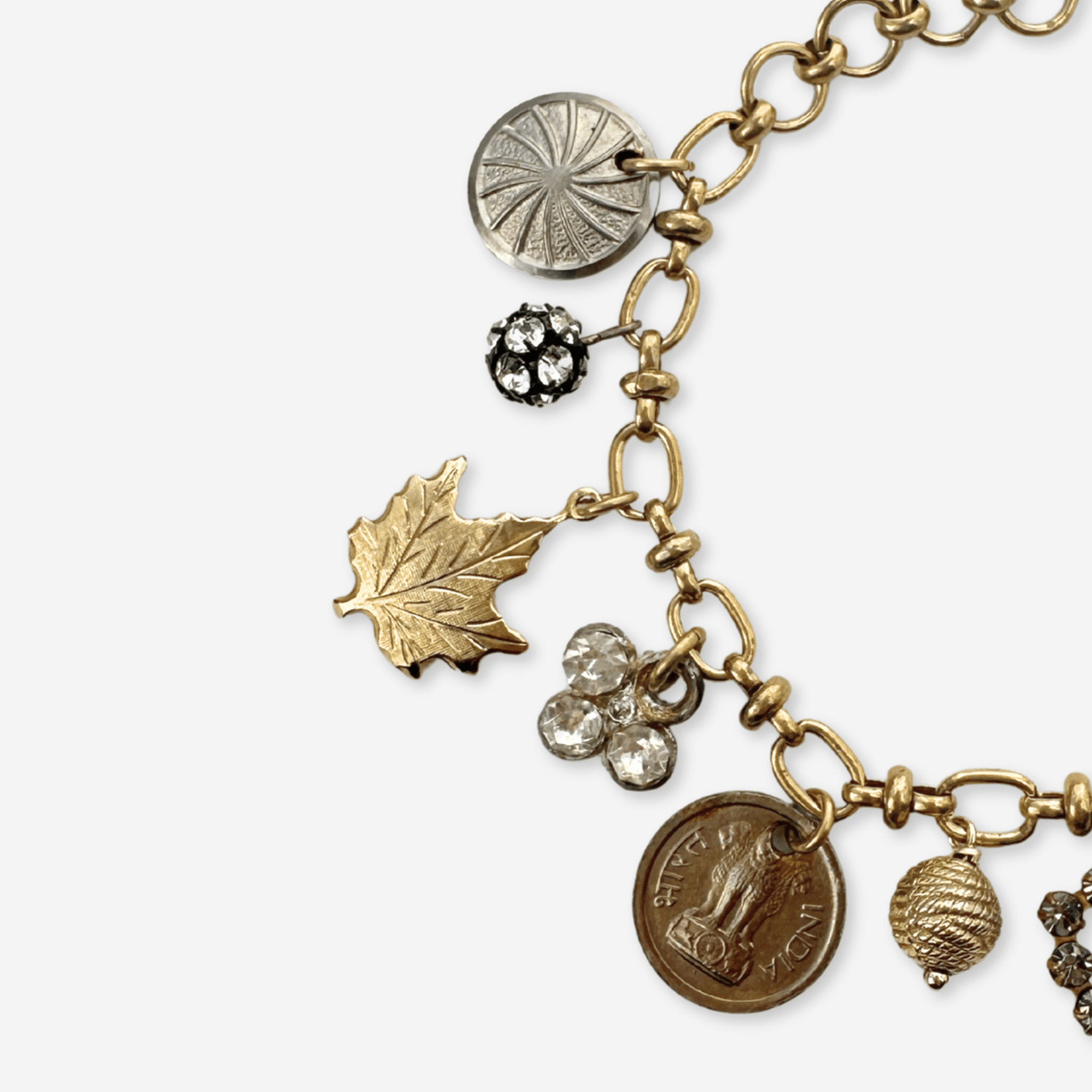 Repurposed vintage mixed metal charm bracelet