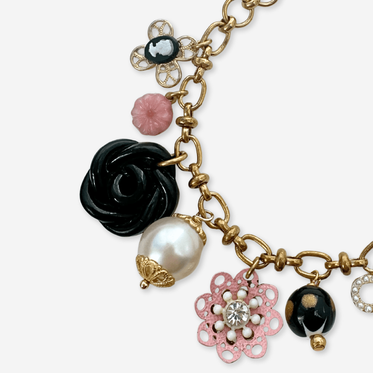 Repurposed vintage pink, black, and white  mixed charm bracelet