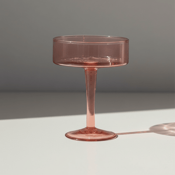 Blush Handblown Hammered Coupe Mixed Beverage Glasses are sold individually.