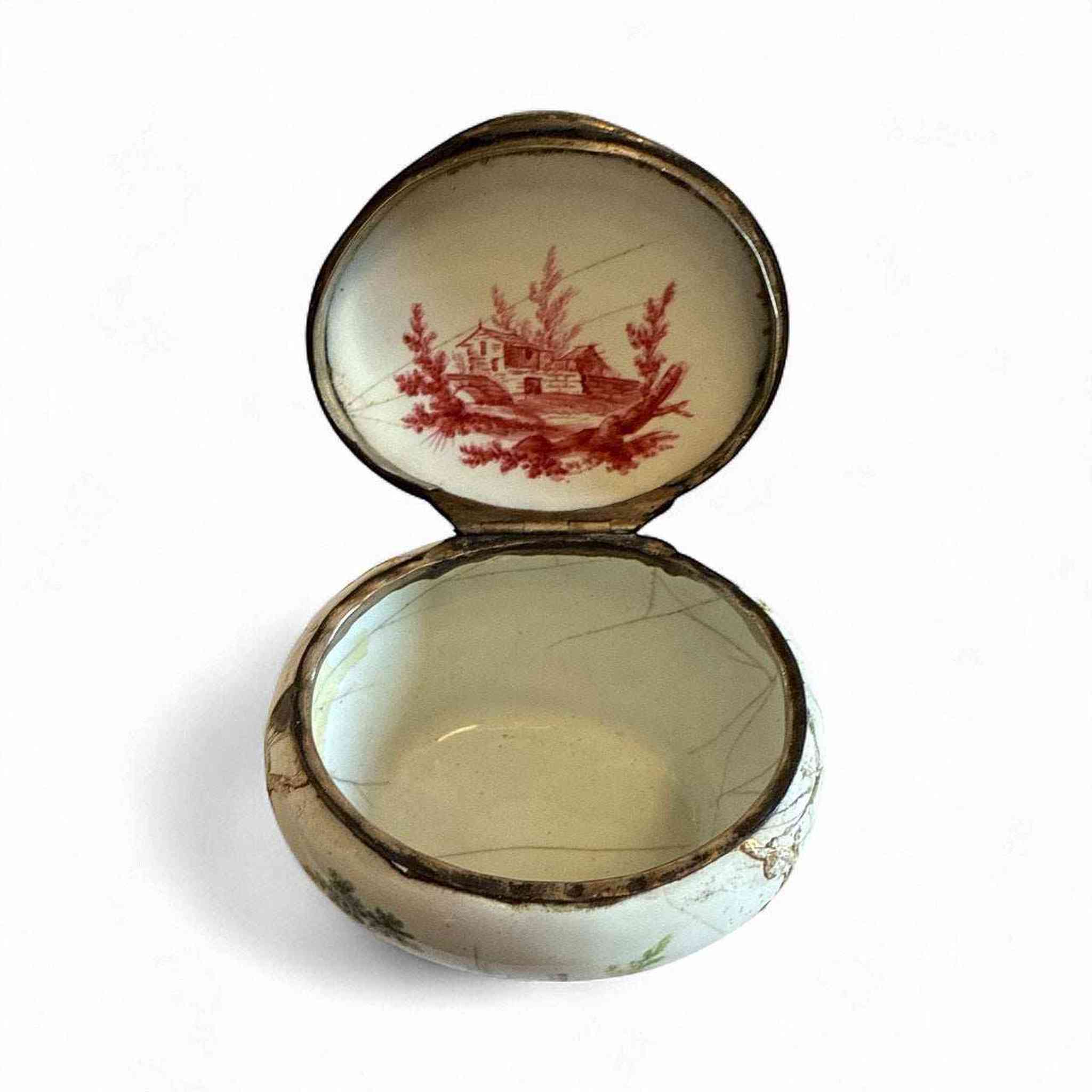 A French Porcelain Snuff Box with silver Mounts