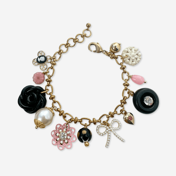 Repurposed vintage pink, black, and white  mixed charm bracelet