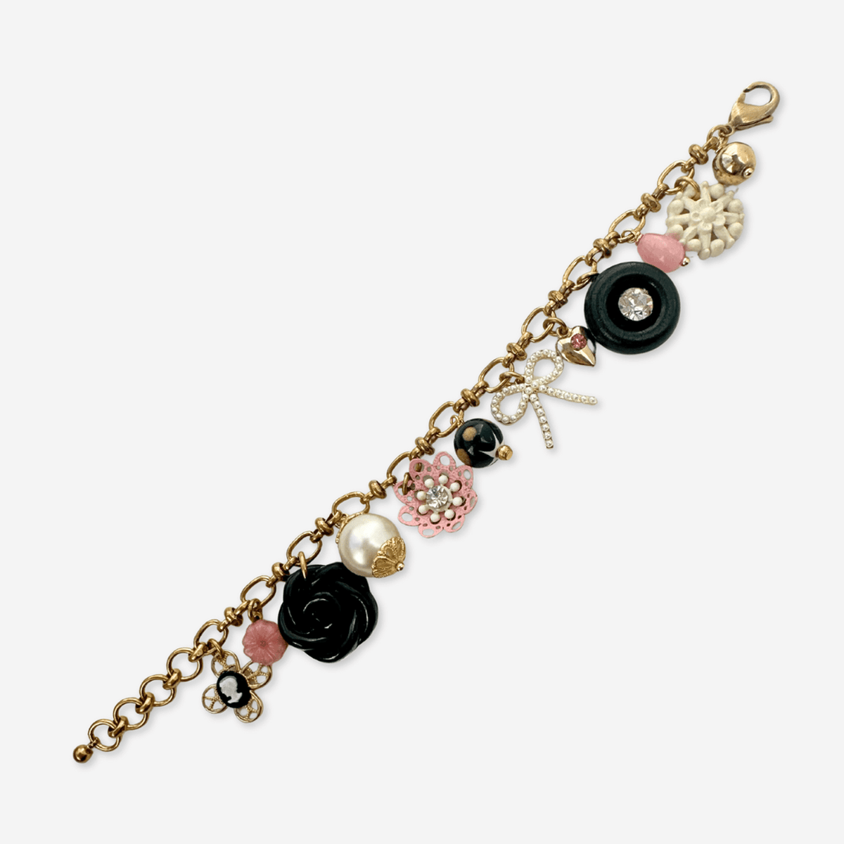 Repurposed vintage pink, black, and white  mixed charm bracelet