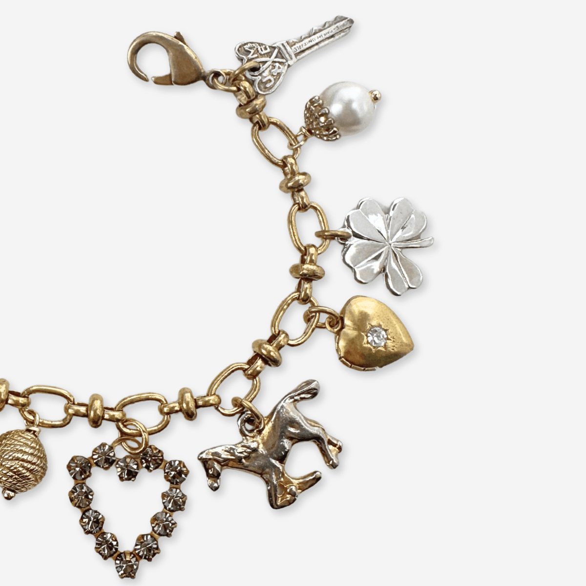 Repurposed vintage mixed metal charm bracelet