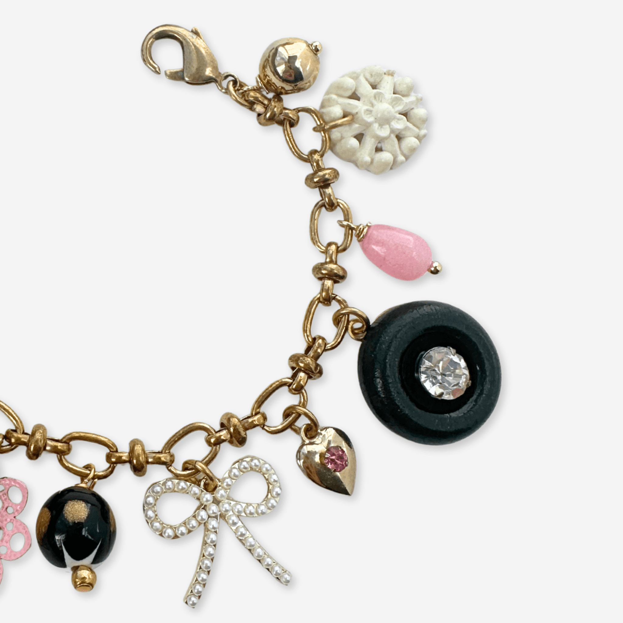 Repurposed vintage pink, black, and white  mixed charm bracelet
